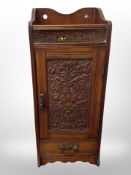 A Victorian carved walnut smoker's cabinet,