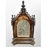 An impressive Victorian Gothic Revival carved oak bracket clock,