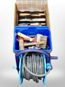 A box of hose pipe on reel, assorted hand tools,