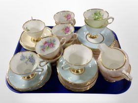 A collection of Clare bone china teacups, saucers,