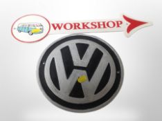 Two cast iron VW signs,