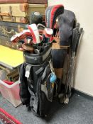 Two golf bags containing assorted irons and drivers