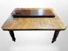A late Victorian oak dining table,
