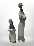 A Lladro figure of a lady carrying a lamb and a similar figure of a girl holding a pig
