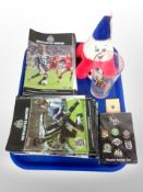 A group of Newcastle United football programmes, pin badges, 1998 world cup glass,