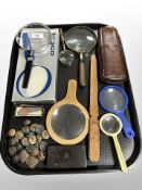 A group of magnifying glasses, military buttons, Bakelite snuff box,