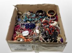 A box of costume jewellery, bead necklaces, bangles,