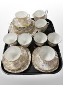 Twenty-seven pieces of Vale gilt tea china