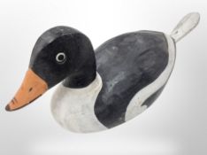 A painted wooden decoy duck,