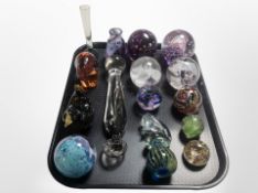 A group of glass paperweights,