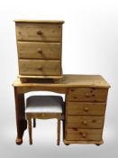 A contemporary pine four drawer dressing table with stool and similar bedside chest