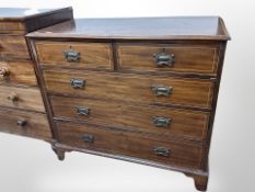 A 19th century mahogany and satinwood inlaid five drawer chest on bracket feet,
