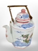 A large Oriental style porcelain teapot,