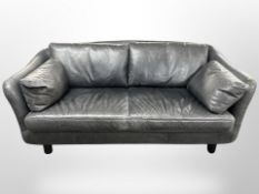 A late 20th century Danish two-seater settee in grey stitched leather,