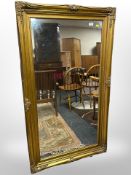 A Victorian style rectangular gilt framed mirror 141 cm x 79 cm