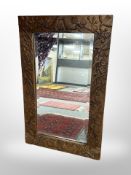 A carved oak framed mirror 77 cm x 48 cm