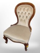 A Victorian style buttoned back lady's chair