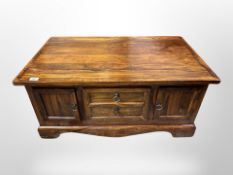 A stained pine storage coffee table,