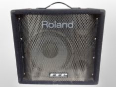 A Roland DB-500 D-Bass amplifier with lead