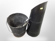 A metal coal scuttle, similar bucket,