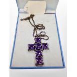A 1980's Butler and Wilson Crystal crucifix pendant on similar chain CONDITION REPORT: