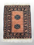 A small Eastern hearth rug 79 cm x 53 cm