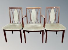 A reproduction G-Plan extending oval dining table and six chairs
