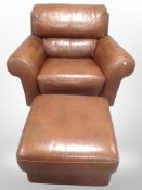 A contemporary brown leather stitched armchair with matching footstool