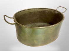 A brass twin handled oval pan,