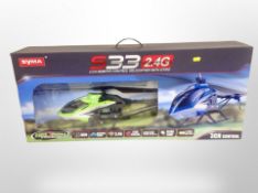 A Syma S33 three channel remote control helicopter in box