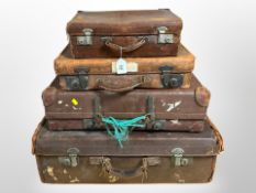 Four vintage stitched leather suitcases