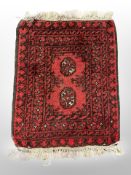 A small Afghan Bokhara rug 73 cm x 51 cm