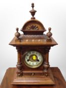 A late Victorian walnut eight day mantle clock,