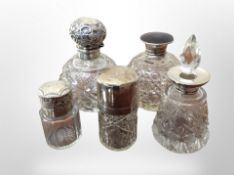 Five silver mounted crystal dressing table bottles, tallest 12.