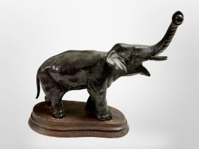 A Japanese Meiji period bronze on elephant on later wooden plinth,