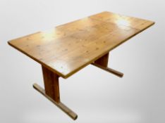 A 20th century pine drop end extending dining table,