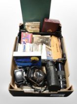 A box of vintage cameras and lenses, set of dominoes, colour postcards,