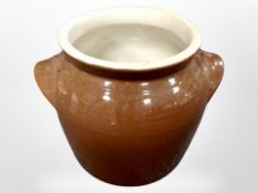 A glazed stoneware crock pot,