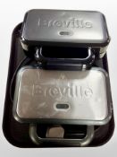 Two Breville toasting machines