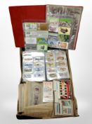 A box of cigarette cards and phone cards