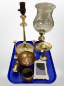 A brass lamp base together with pair of candlesticks, oil lamp base with clear glass shade,