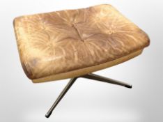 A 20th century Scandinavian tan leather footstool on chrome support