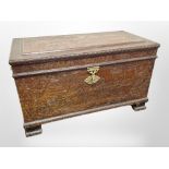 A heavily carved camphor wood blanket chest,