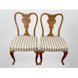 A pair of continental carved oak salon chairs