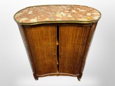 A continental walnut kidney shaped sliding door cabinet with marble top,