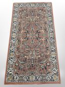 A machine-made rug of Persian Saroukh design,