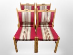 A set of four Danish blond oak dining chairs