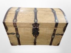 A 19th century oak and wrought iron bound domed topped chest,