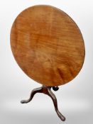 A George III style mahogany tilt top tripod table,