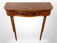 A yew wood serpentine fronted side table,